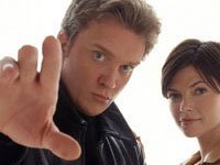 Anthony Michel Hall and Nicole deBoer from The Dead Zone.