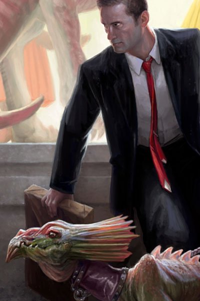 A man in a black suit sits with a small colorful dragon.