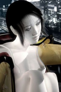 A pale woman sits with a futuristic city behind her.