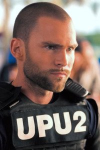 Seann William Scott as Private Roland Taverner / Officer Ronald Taverner.