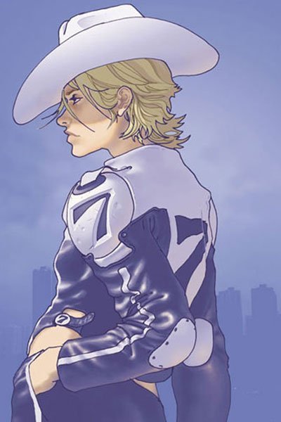 A woman with blond hair and a white cowboy hat casually stands.