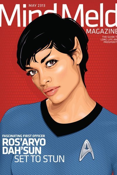Rosario Dawson as a Vulcan wearing a blue Starfleet uniform.