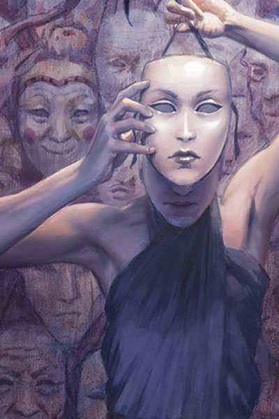 A slender woman hides her face behind a passive mask, with a wall full of other masks behind her.