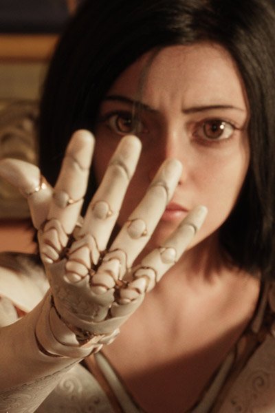 Rosa Salazar as Alita studies her new hand.