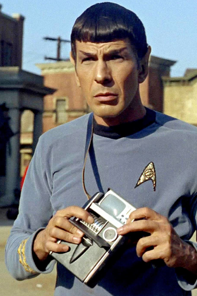 Lt. Commander Spock holding a tricorder, as designed by Wah Chang.