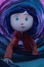 Coraline crosses into the other world through a long florescent tunnel.