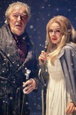 Kazran Sardick (Michael Gambon) and Abigail (Katherine Jenkins) stand in the snow.