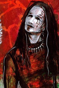 A lanky man with long black hair and white face makeup.