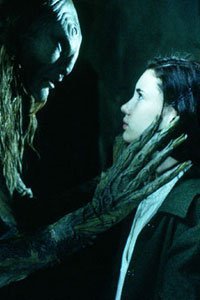 Ofelia (Ivana Baquero) confronts the faun (Doug Jones).